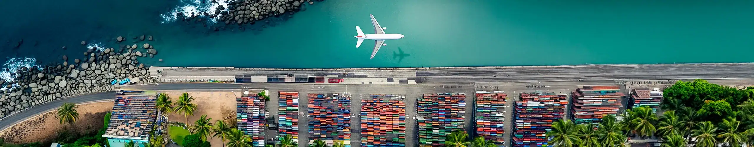 Cargo ship with colorful containers docked at port, showcasing logistics and freight transportation services.